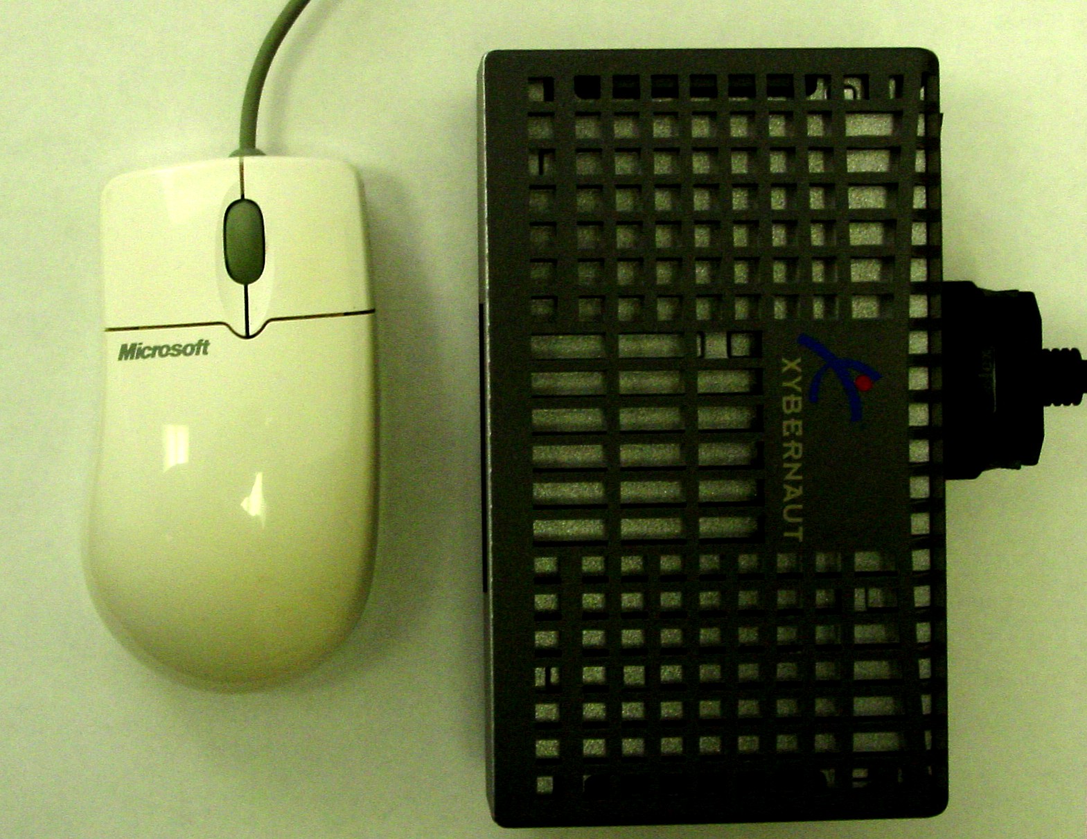 Xybernaut MA-V wearable PC photographed next to a Microsoft mouse for size reference — A1SI's own period photograph documenting the actual hardware the ISA Event Photo System ran on the photographer's belt.